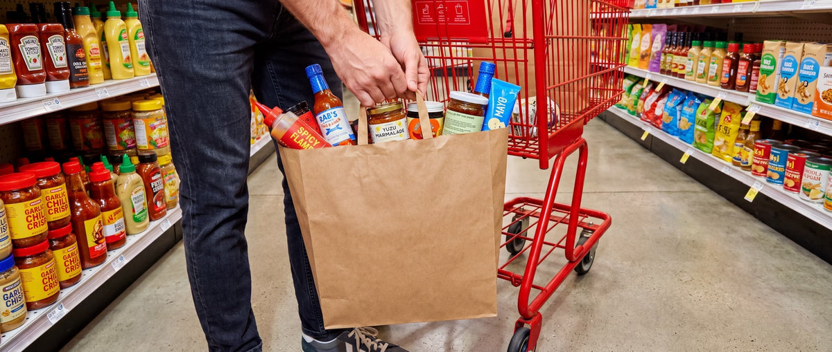 Kraft paper bag held by the handles
